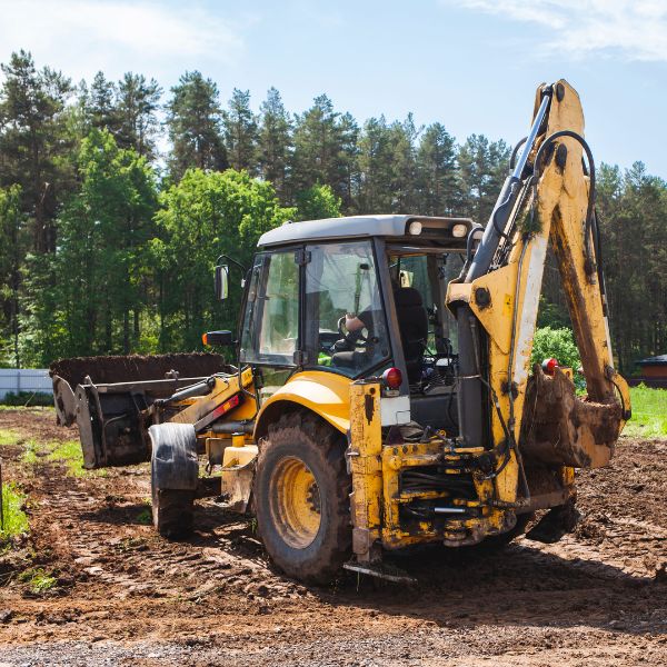 Earthmoving equipment in action during land clearing work on a rural site by Rural Property Services NSW