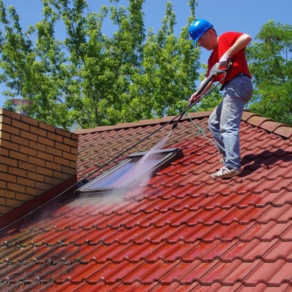 Professional roof cleaning Sydney by Roofing Guys Sydney removing moss and dirt with high pressure washing