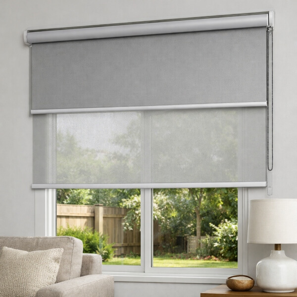 Light grey roller blinds with dual layers for flexible light filtering and blockout privacy professionally installed by Blinds and Shutter Guys Newcastle