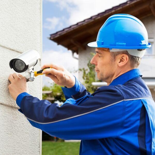 Home Security Guys completing professional home security camera repairs in Sydney including wired CCTV setup outdoor camera mounting and secure system connection